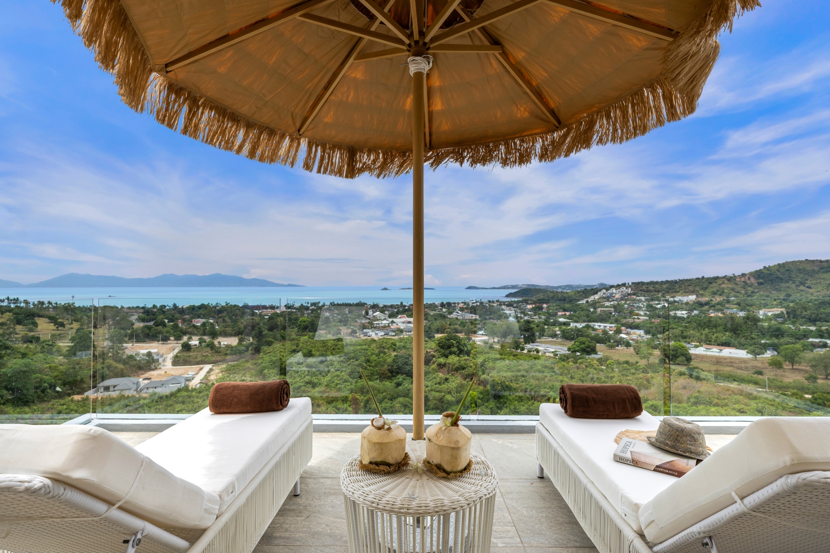 Private rooftop deck with fringed umbrella and sun loungers